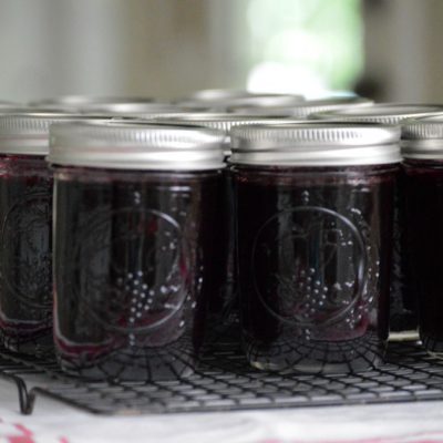 blueberry jam in jars on cooling rack