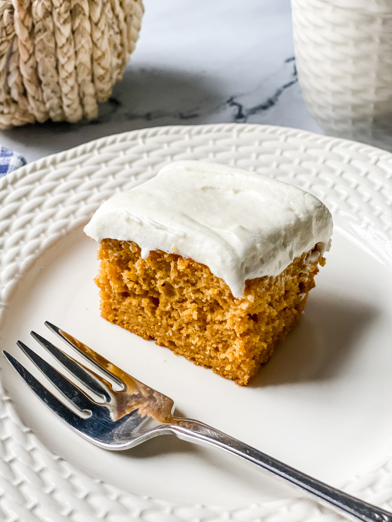 pumpkin bar with cream cheese frosting on a plate with fork