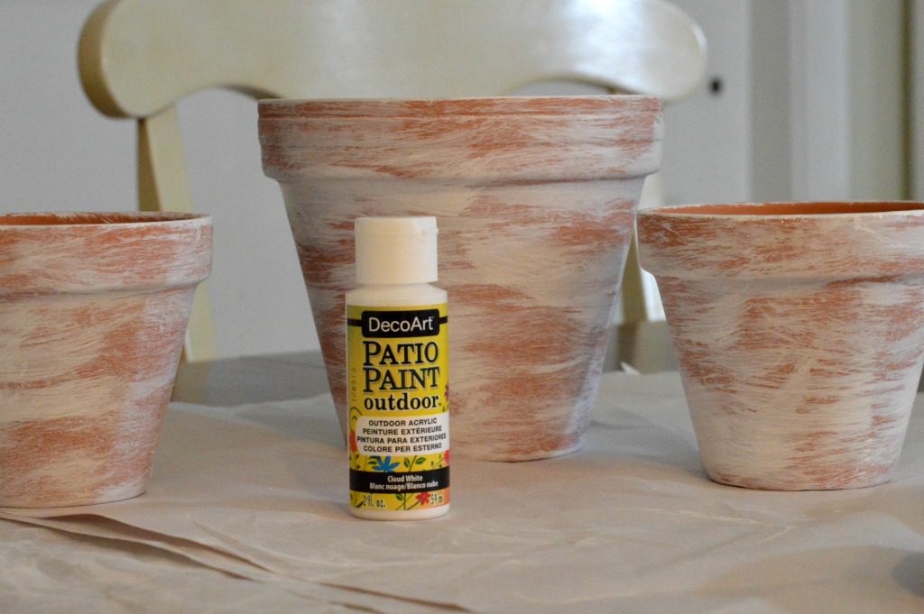 view of terracotta pots after receiving a coat of Deco Art patio paint to make them look aged