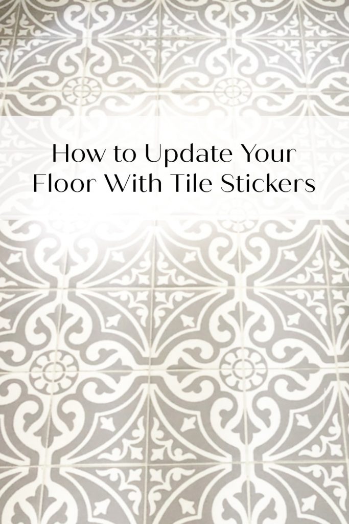 view of bathroom floor with tile stickers