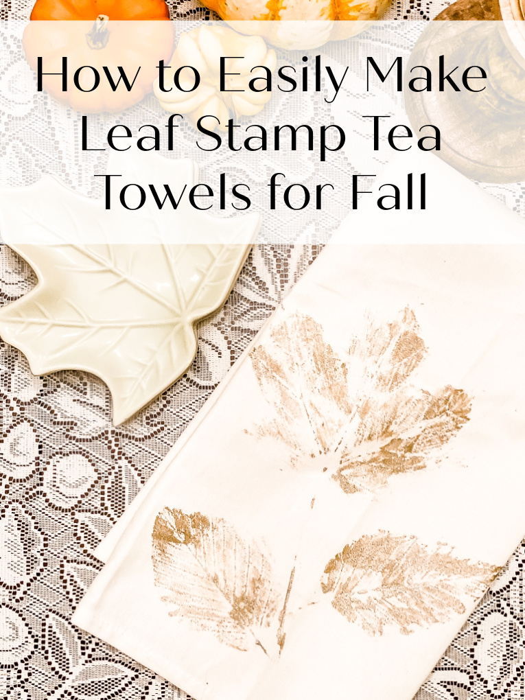 view of leaf stamped tea towel with leaf side plates and pumpkins