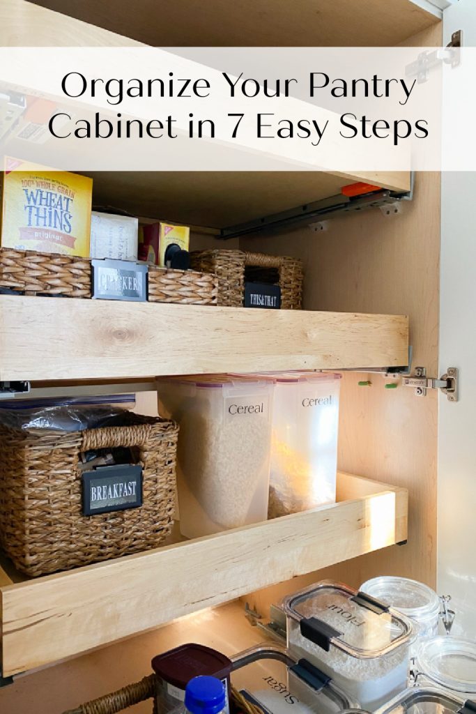 pantry cabinet with pull out shelves, organized with labeled baskets and plastic storage containers