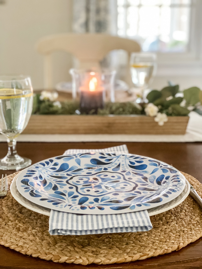 view of kitchen table with blue and white melamine dishes