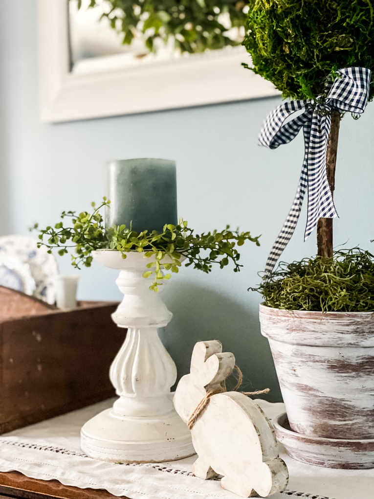 sharing spring decorating ideas with view of sideboard with diy topiary and candle holder