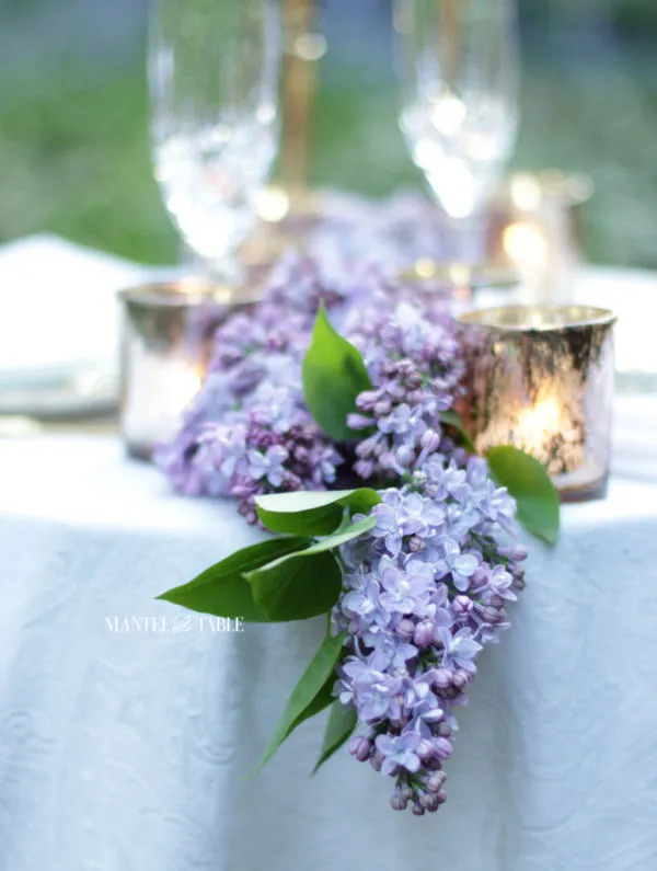 Mantle and Table's lilac garland centerpiece