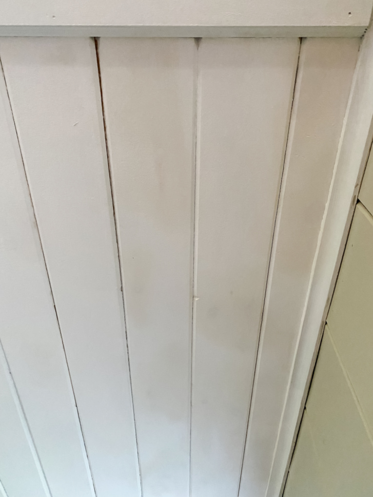 view of water stained ceiling with primer only
