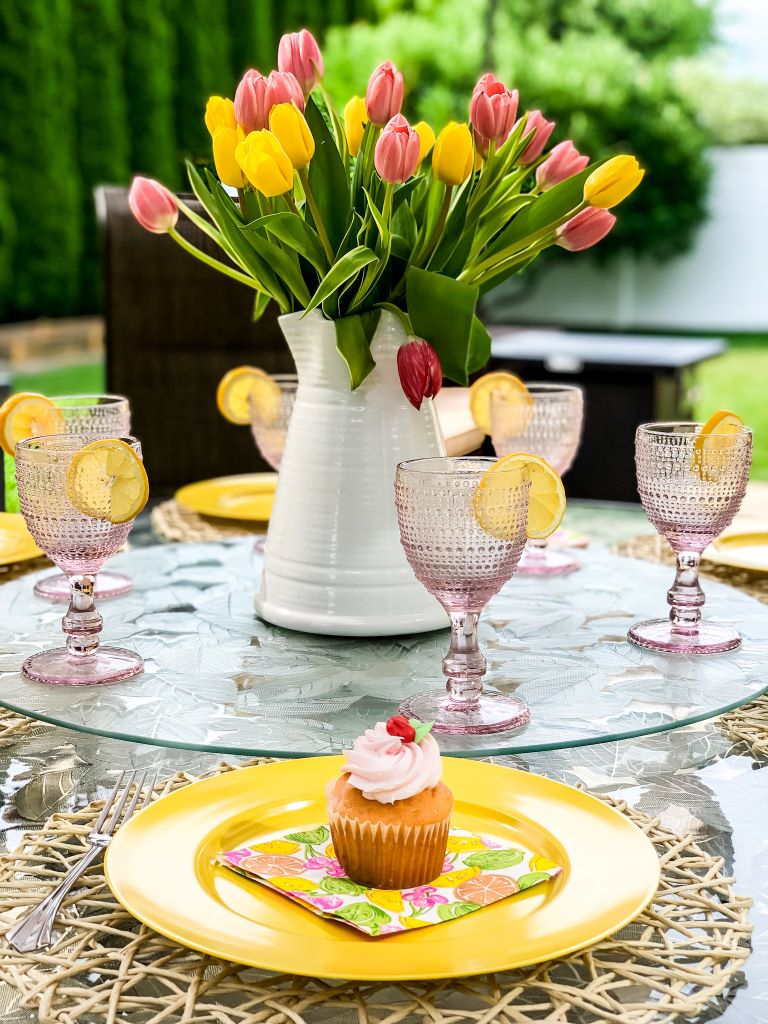 pink and yellow tablescape with tulip centerpiece