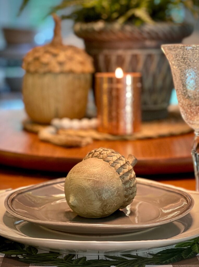 fall place setting with acorn on a plate