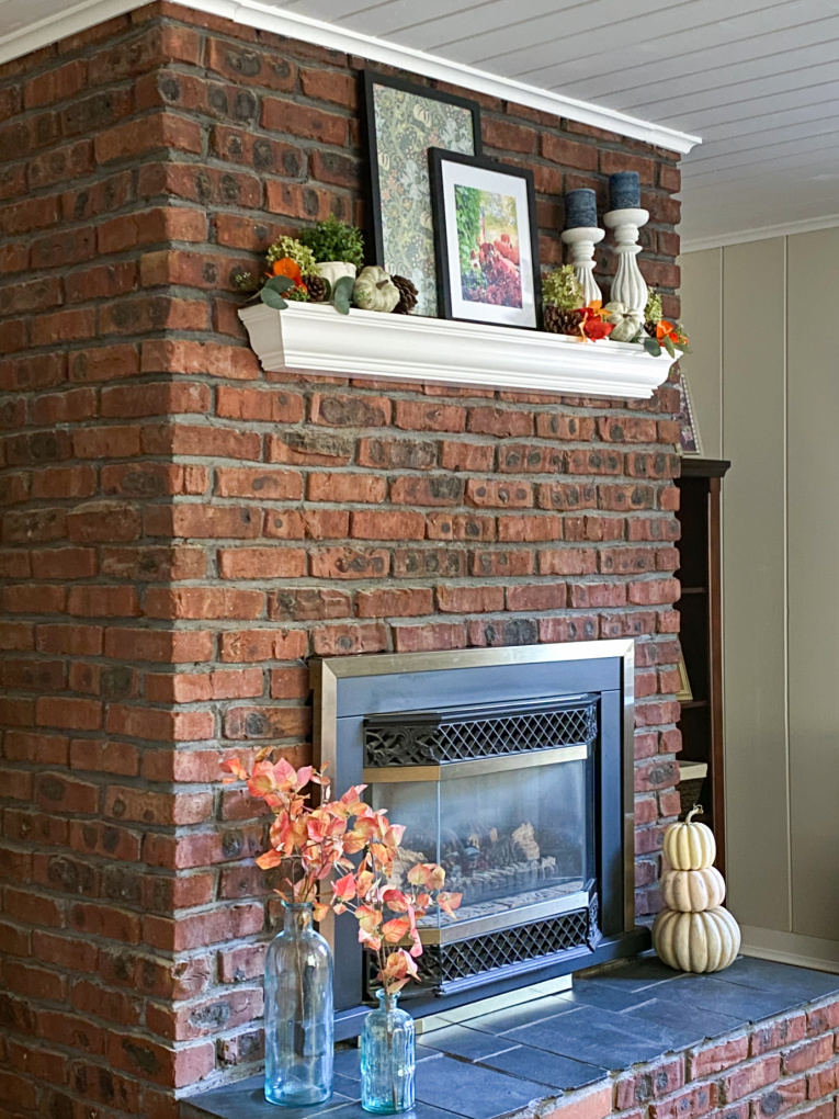 fall decorated fireplace, mantle, and hearth