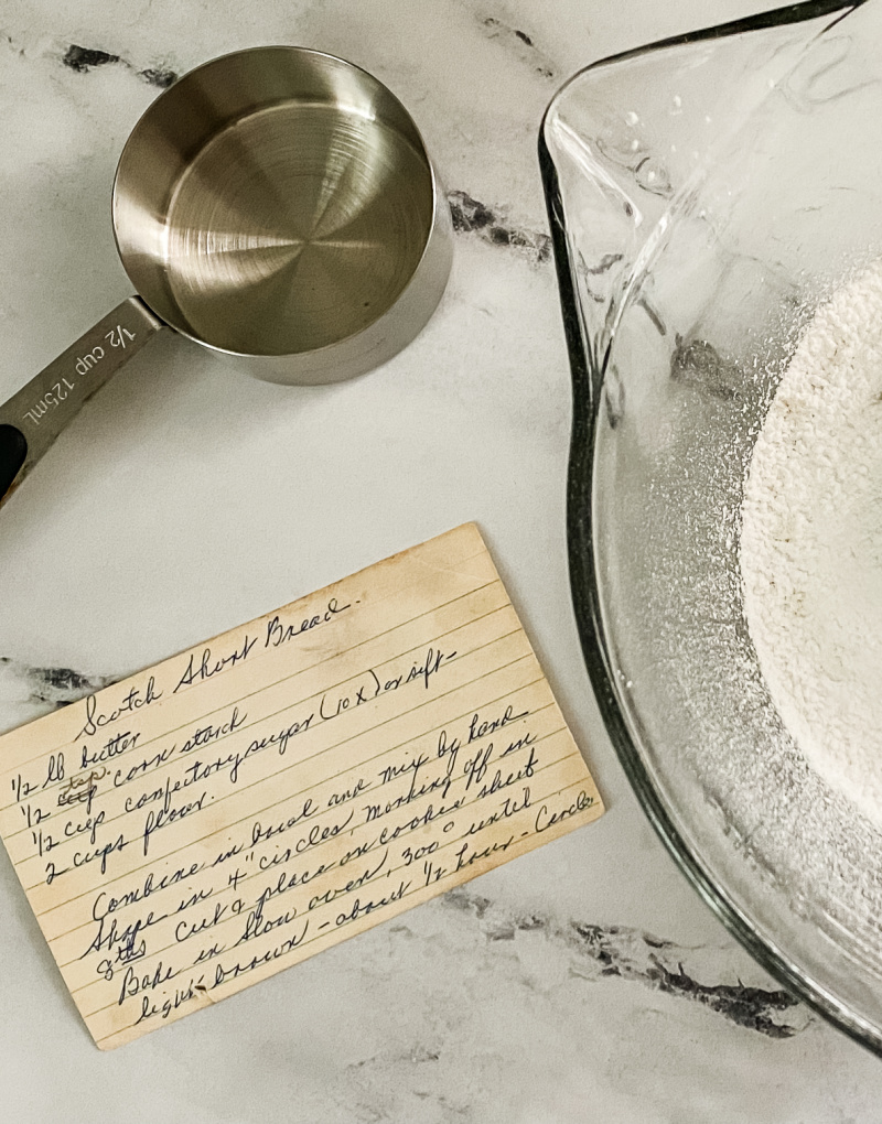 photo of vintage recipe card with measuring cup and bowl filled with dry ingredients