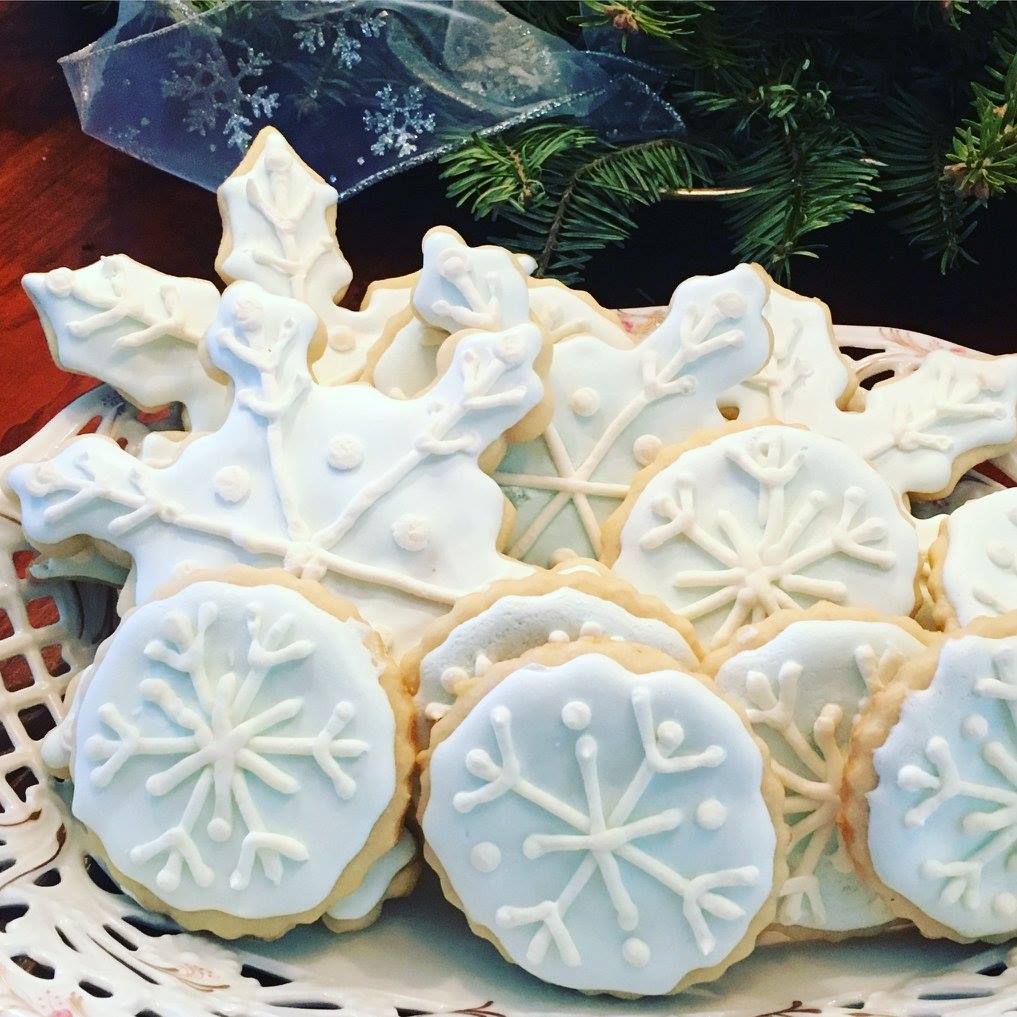 snowflak sugar cookies with light blue and white icing