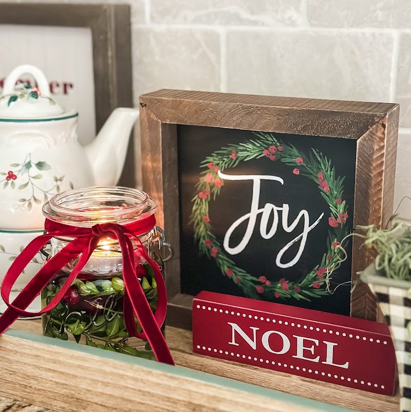 tray with Joy Christmas sign, candle, and teapot