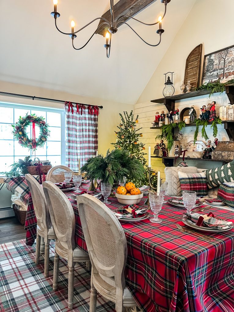 view of dining room decorated for Christmas with variety of plaids